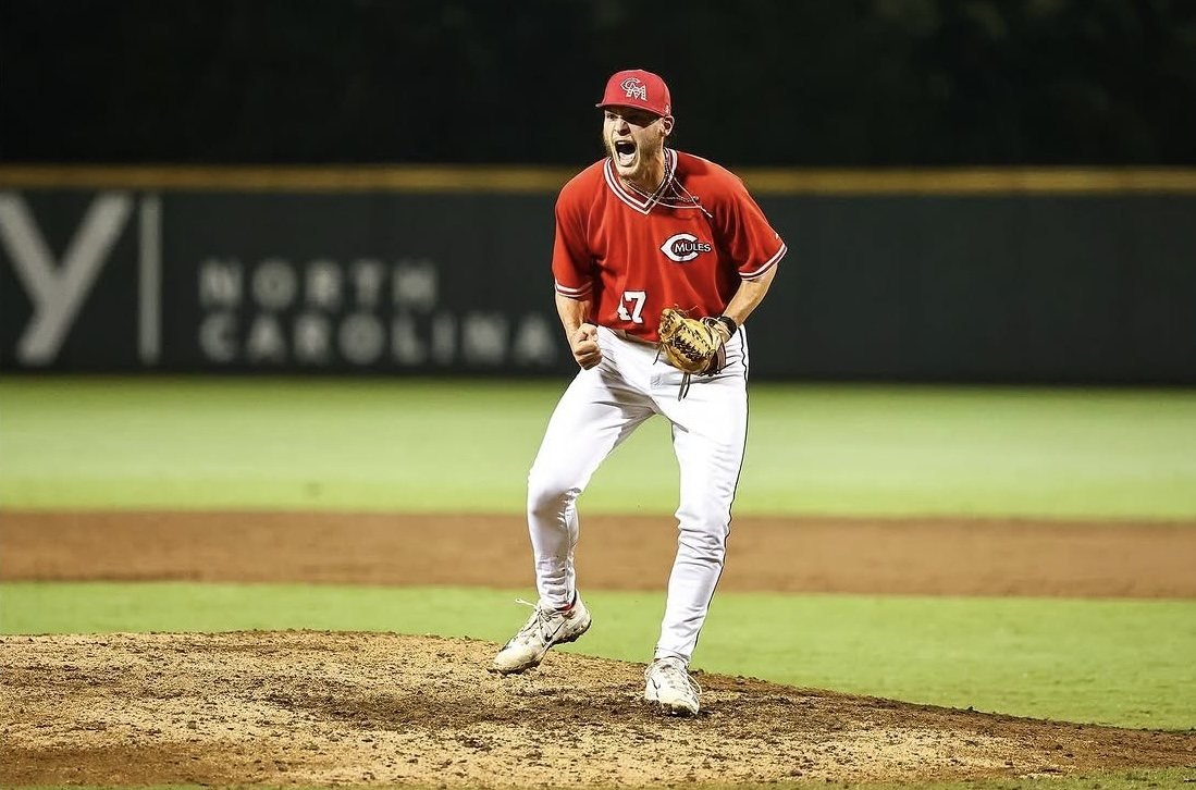 Mules pitcher in red letting out a yell in Cary