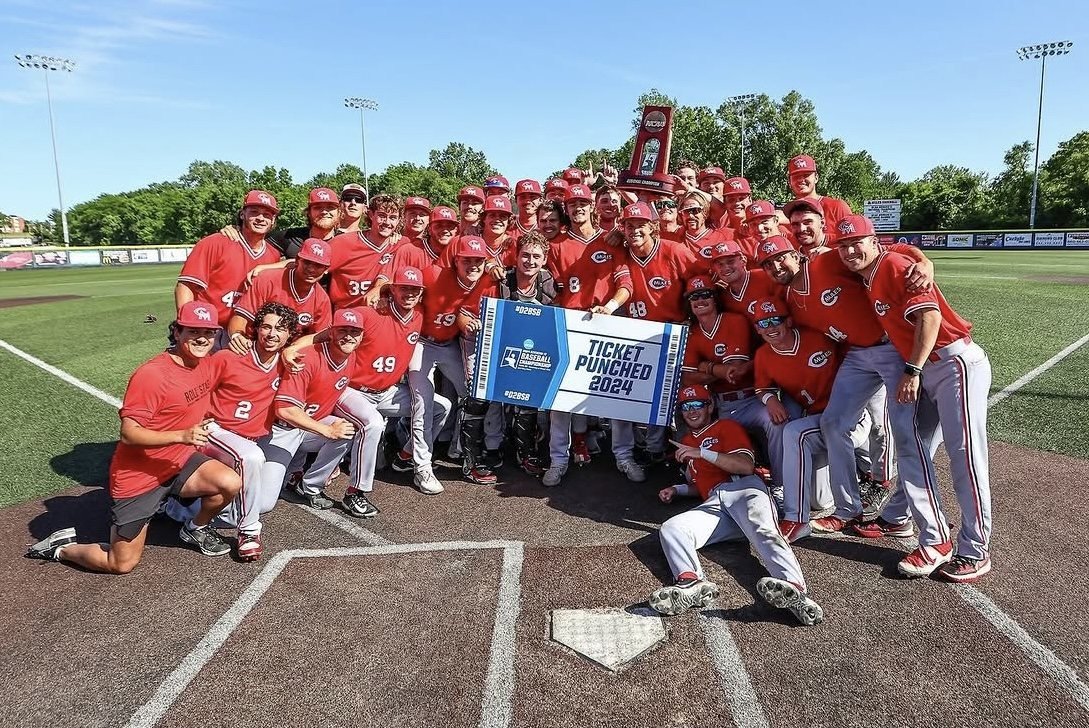 2024 Mules team photo with the Ticket Punched banner at home plate